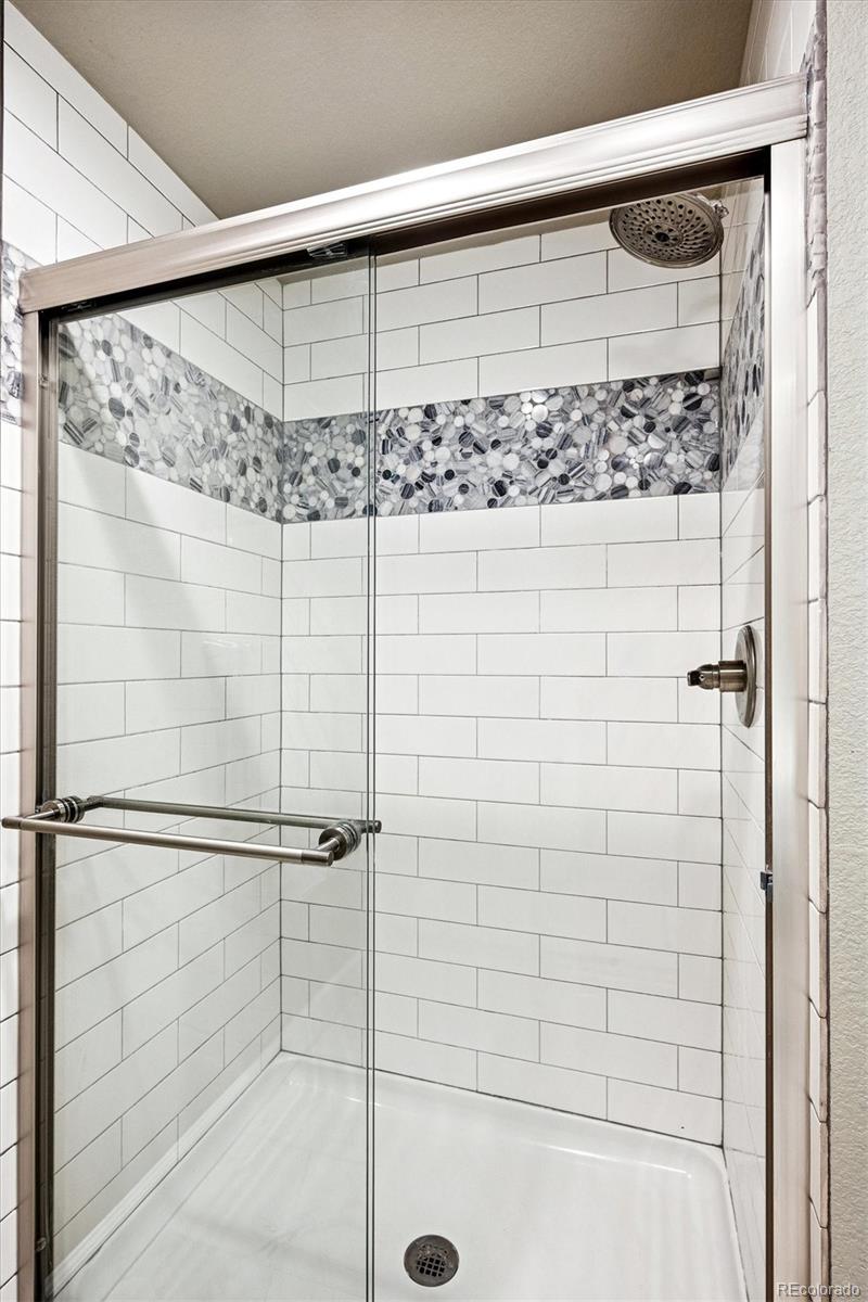 4488 Grapevine Way Castle Rock, CO 80109 - Photo 31 of 46 a bathroom with a shower