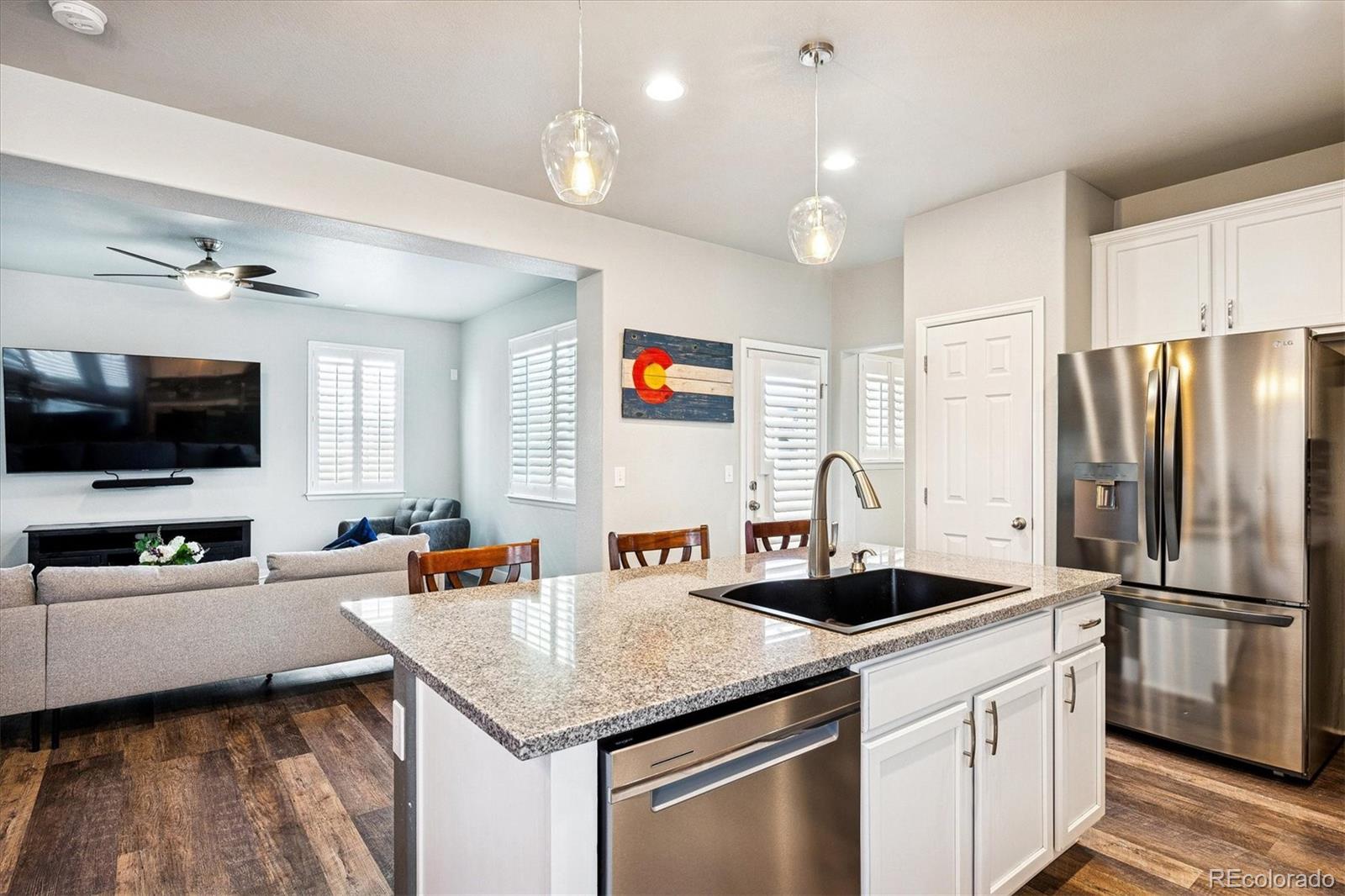 4488 Grapevine Way Castle Rock, CO 80109 - Photo 6 of 46 a kitchen with stainless steel appliances a sink and a refrigerator