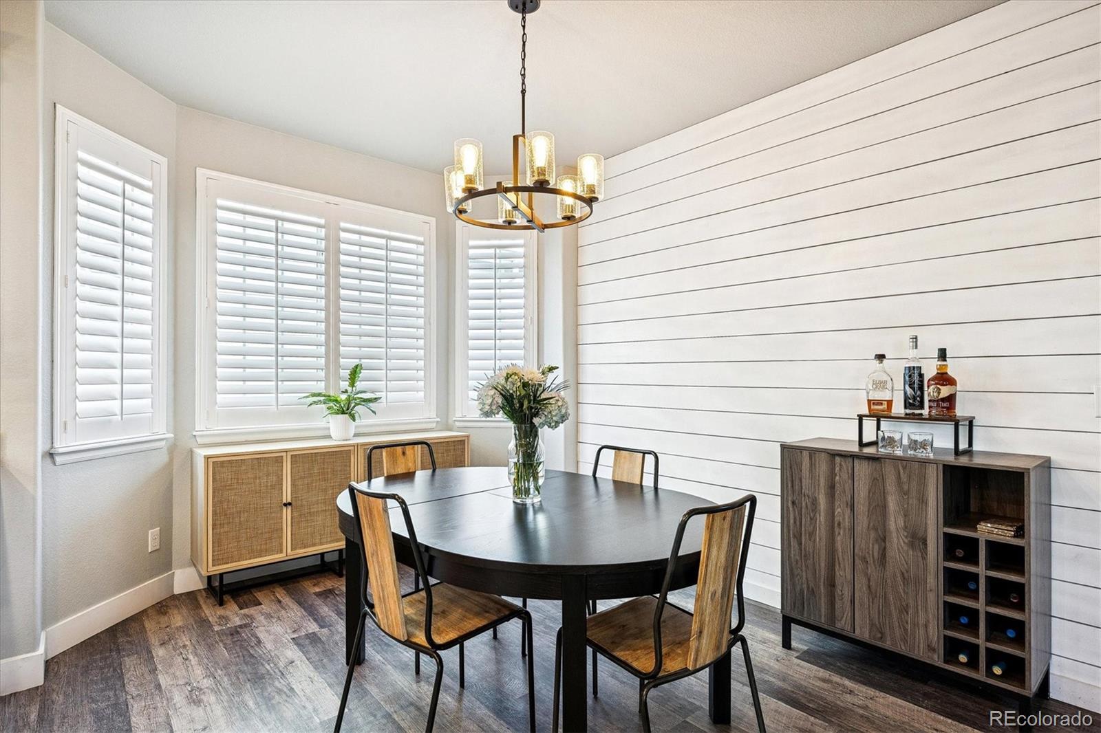 4488 Grapevine Way Castle Rock, CO 80109 - Photo 10 of 46 a view of a dining room with furniture window and wooden floor