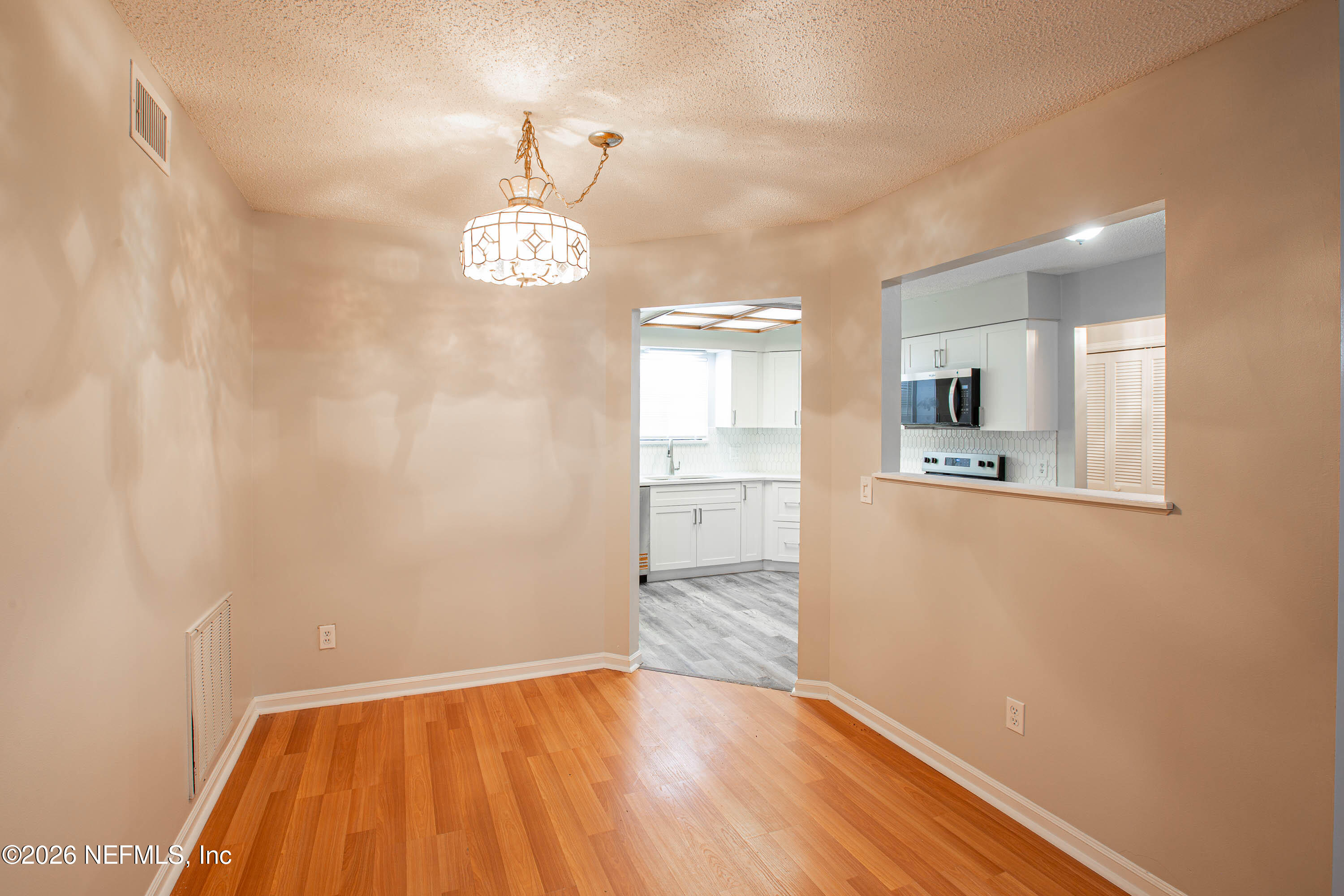 14863 Yellow Bluff Road Jacksonville, FL 32226 - Photo 17 of 48 a view of a kitchen with a sink and dishwasher with wooden floor