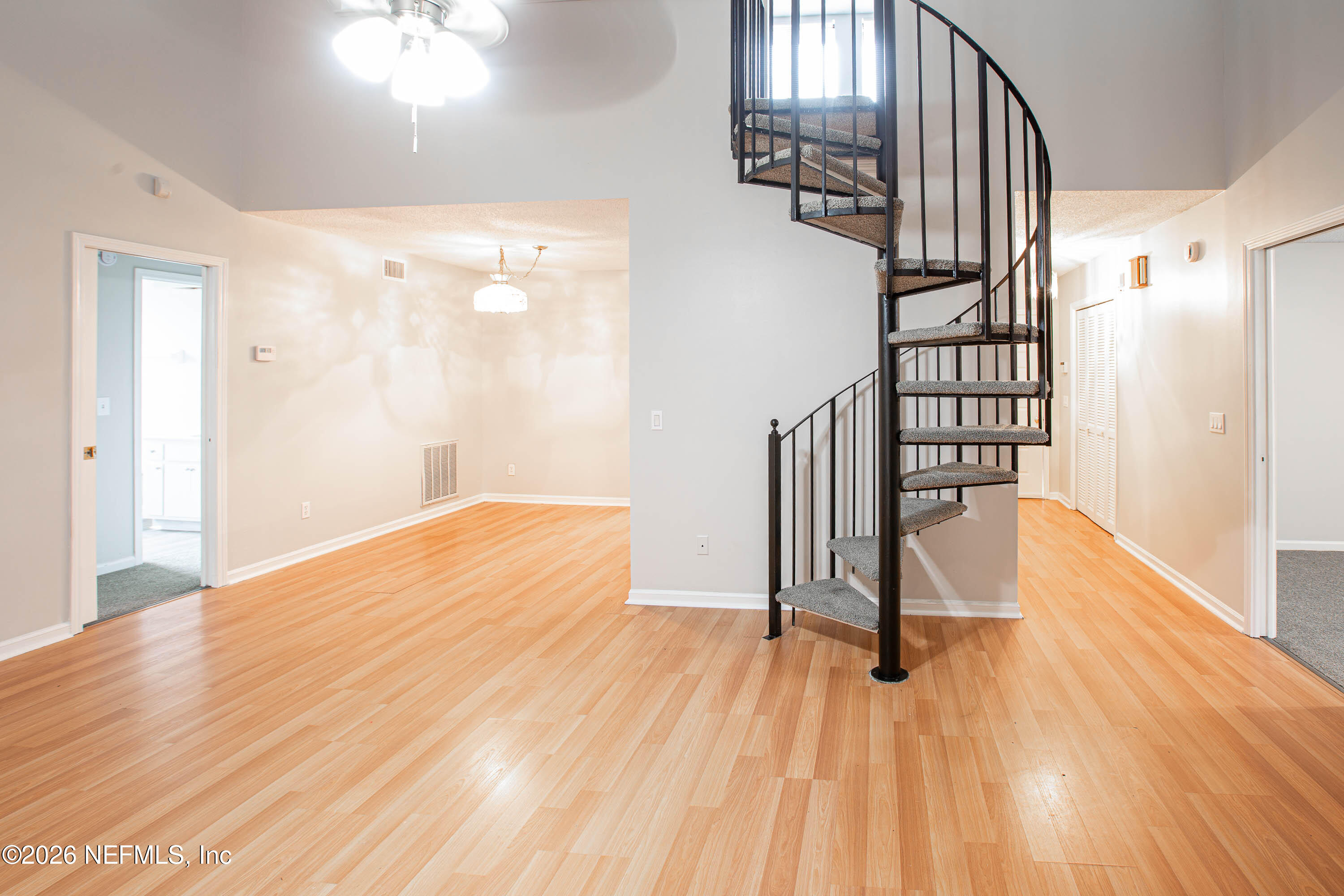 14863 Yellow Bluff Road Jacksonville, FL 32226 - Photo 19 of 48 a view of a room with wooden floor and stairs