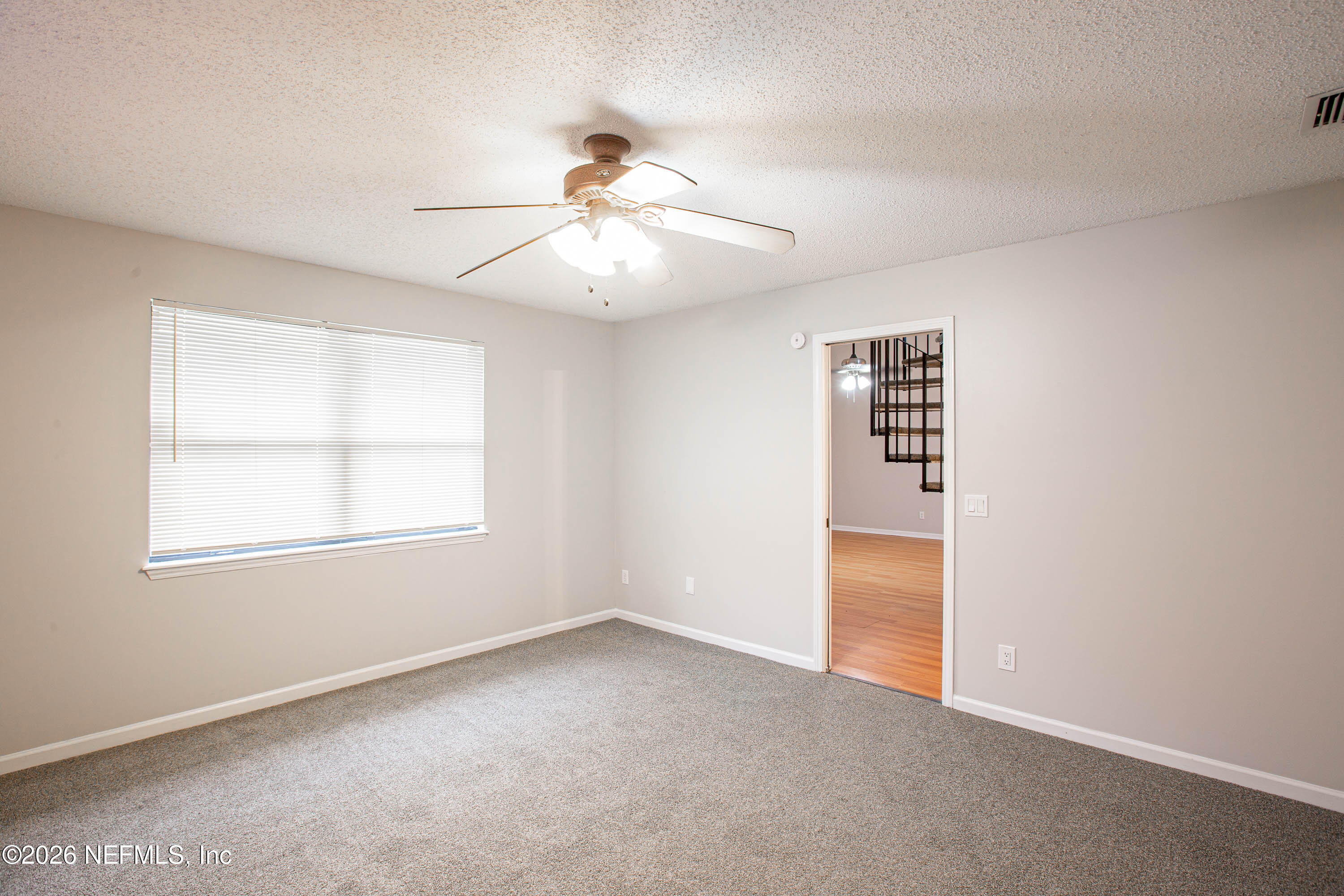 14863 Yellow Bluff Road Jacksonville, FL 32226 - Photo 21 of 48 an empty room with windows and fan