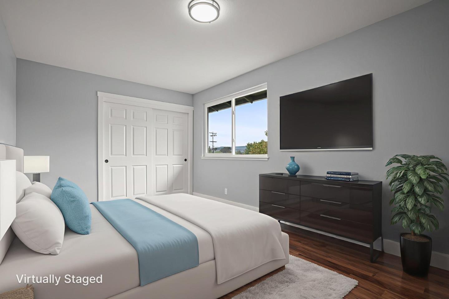 2510 Redwood Road Napa, CA 94558 - Photo 18 of 29 a bedroom with a bed and a flat screen tv