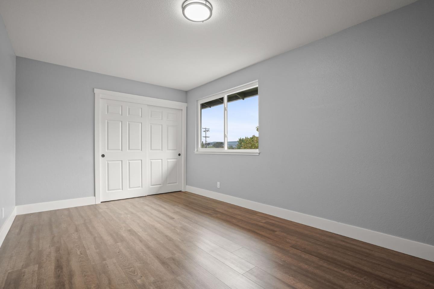 2510 Redwood Road Napa, CA 94558 - Photo 19 of 29 a view of an empty room with wooden floor and a window