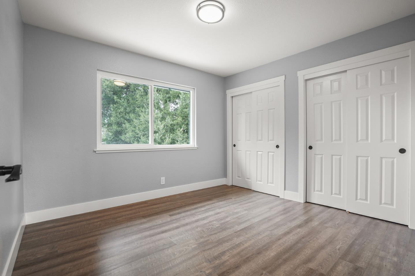 2510 Redwood Road Napa, CA 94558 - Photo 22 of 29 a view of an empty room with wooden floor and a window