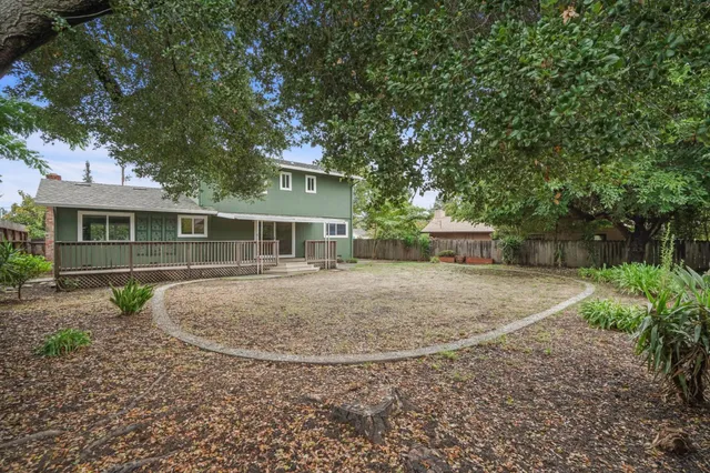 a front view of a house with a garden and porch