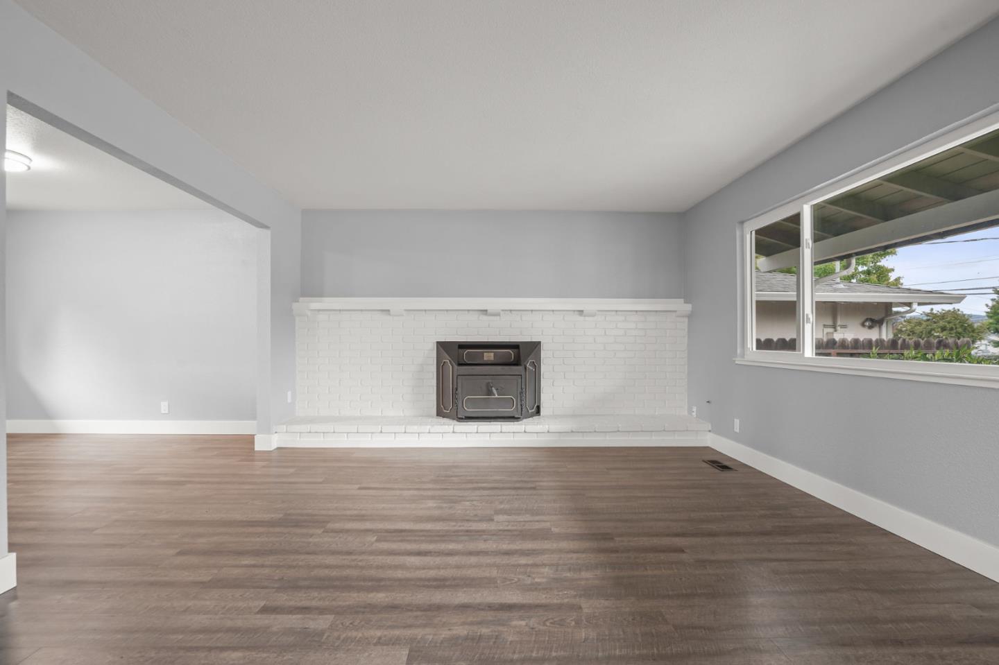 2510 Redwood Road Napa, CA 94558 - Photo 5 of 29 a view of an empty room with a window and wooden floor
