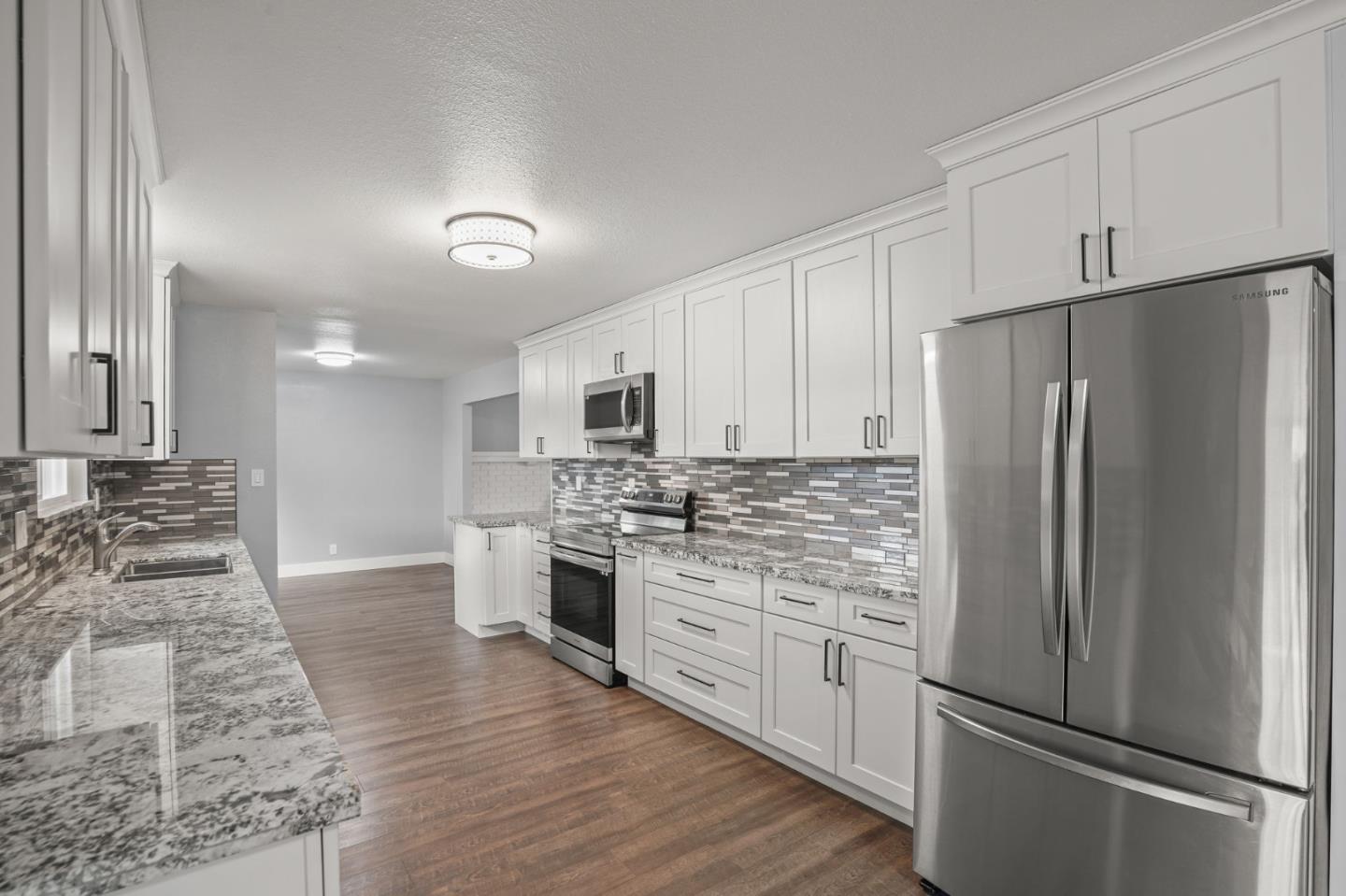 2510 Redwood Road Napa, CA 94558 - Photo 10 of 29 a kitchen with stainless steel appliances a refrigerator sink and stove