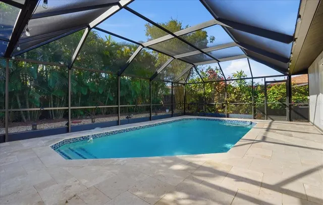 a view of a backyard with swimming pool