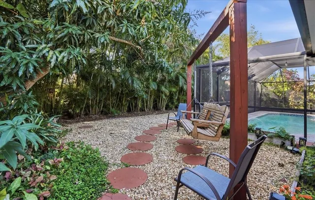 a view of a backyard with sitting area