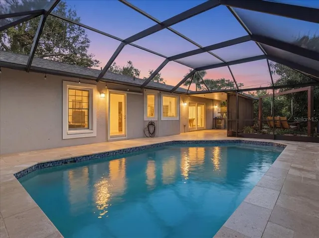 a view of a swimming pool with a patio