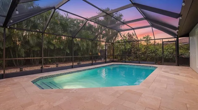 a view of a backyard with a swimming pool