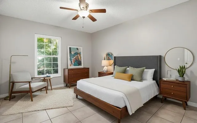 a bedroom with bed and a window