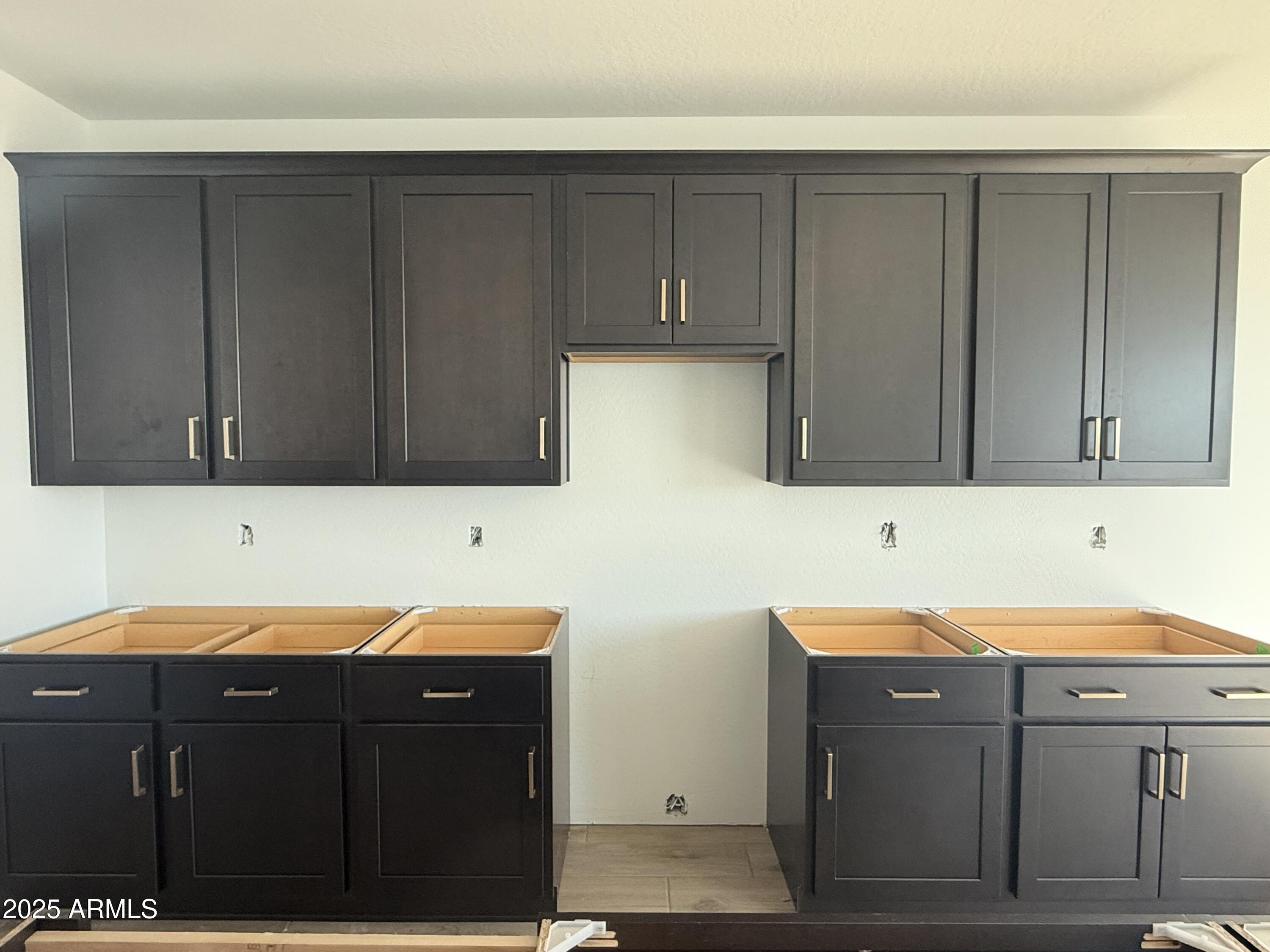 2655 Rustler Road San Tan Valley, AZ 85140 - Photo 16 of 47 a room with a sink and cabinets
