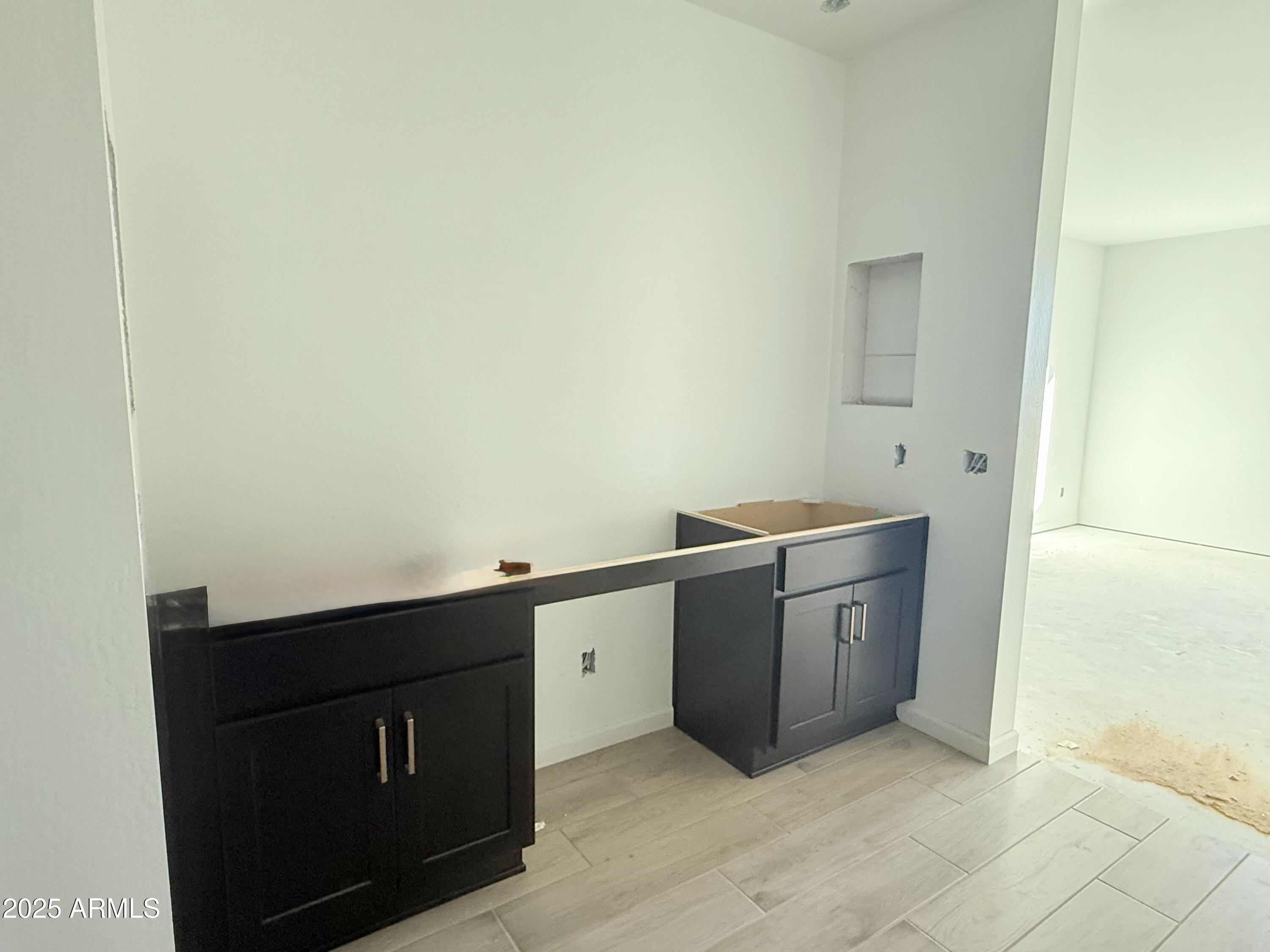 2655 Rustler Road San Tan Valley, AZ 85140 - Photo 24 of 47 a room with a cabinets and washer