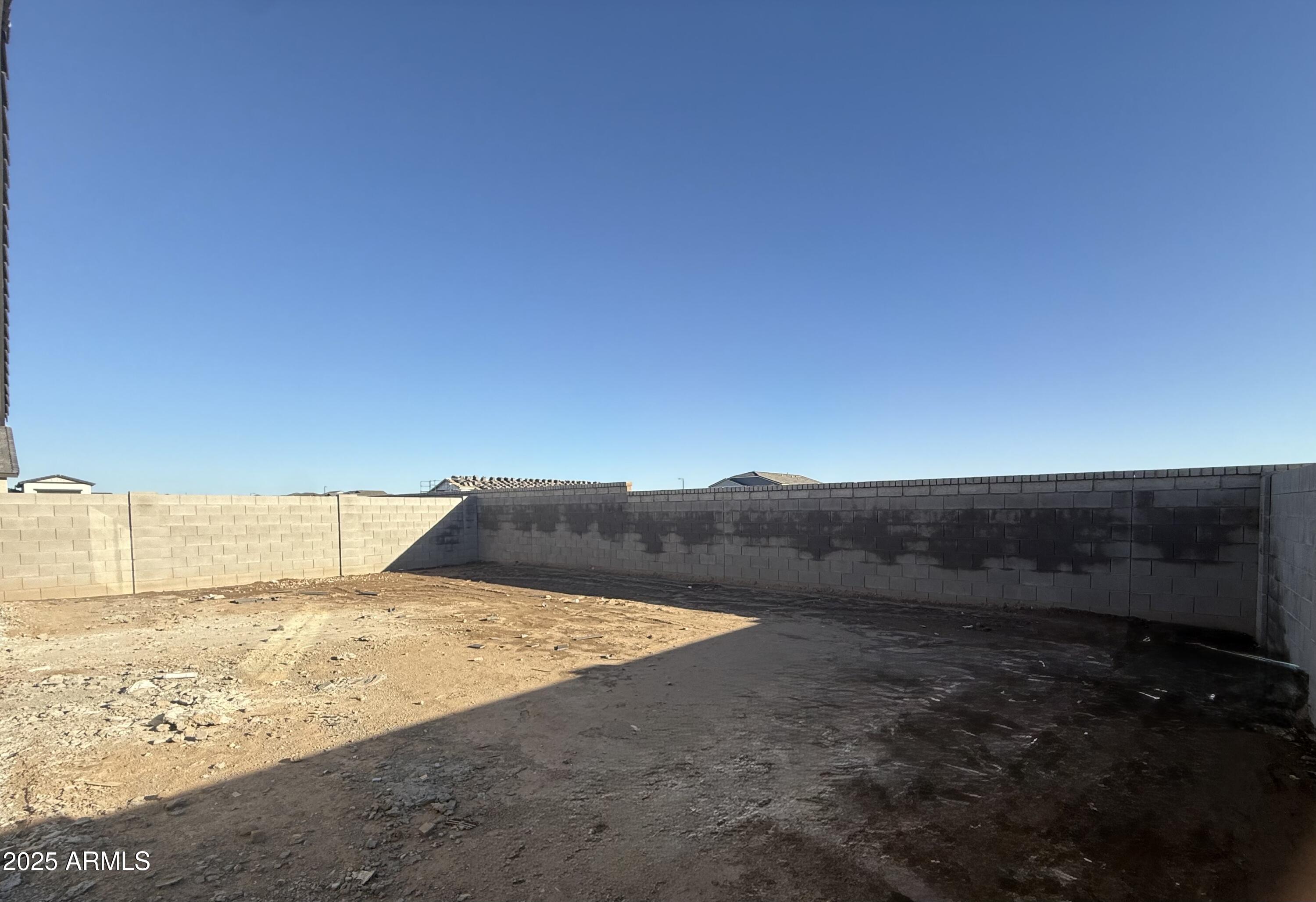 2655 Rustler Road San Tan Valley, AZ 85140 - Photo 28 of 47 a view of a dry yard with wooden fence