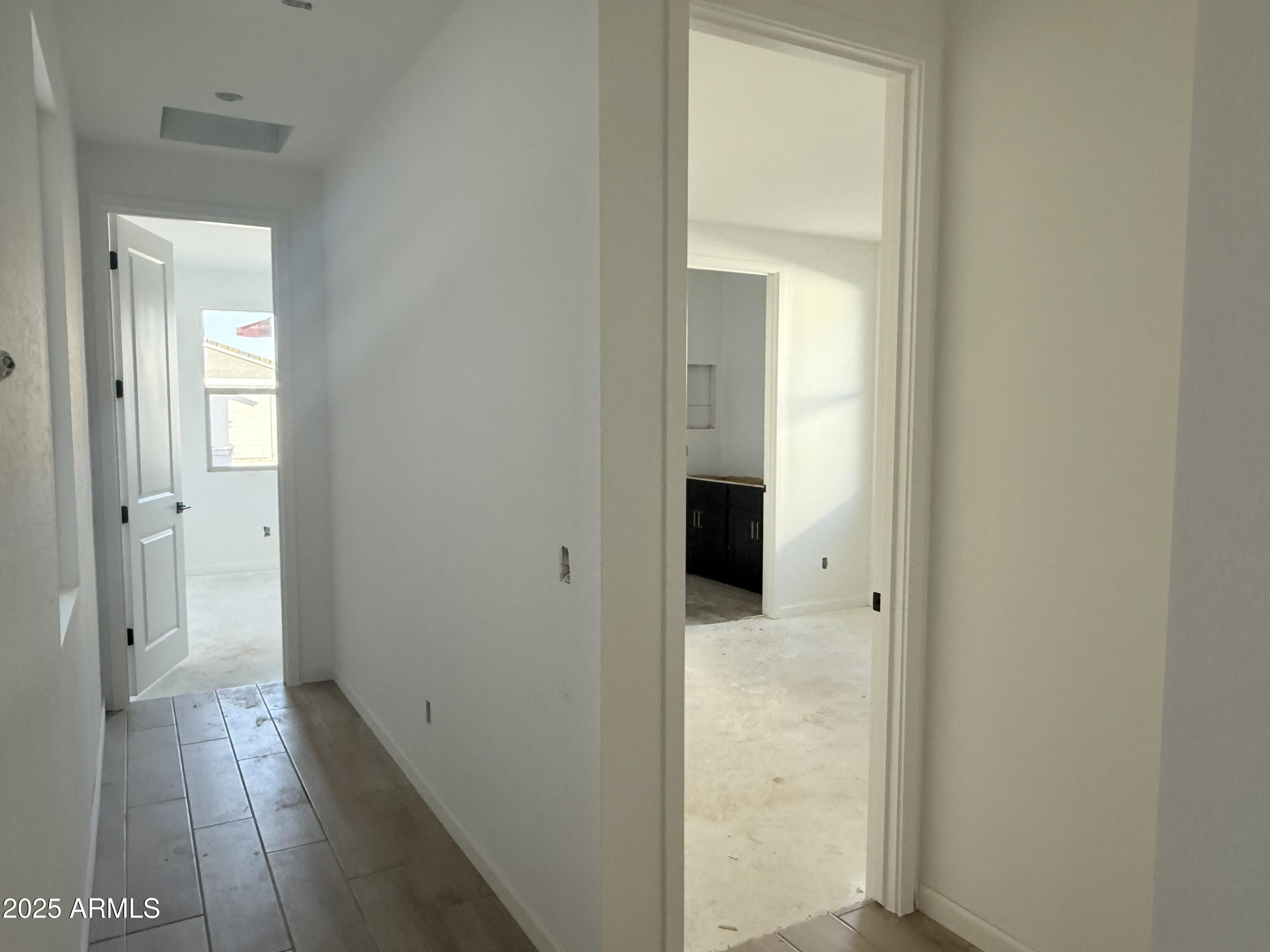 2655 Rustler Road San Tan Valley, AZ 85140 - Photo 5 of 47 a view of a bathroom from a hallway