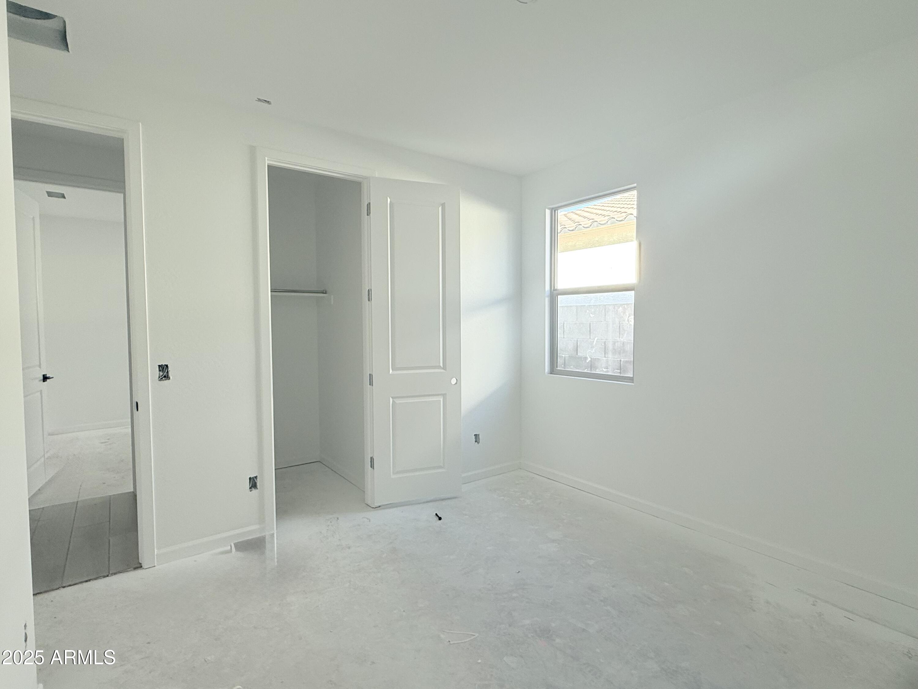 2655 Rustler Road San Tan Valley, AZ 85140 - Photo 6 of 47 an empty room with windows