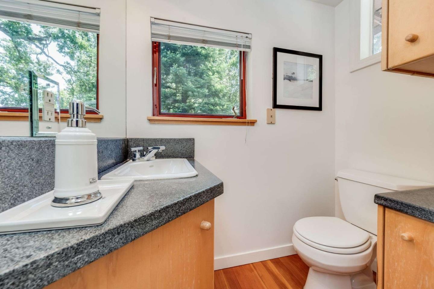 2513 Alpine Road Menlo Park, CA 94025 - Photo 4 of 41 a bathroom with a granite countertop sink and a mirror