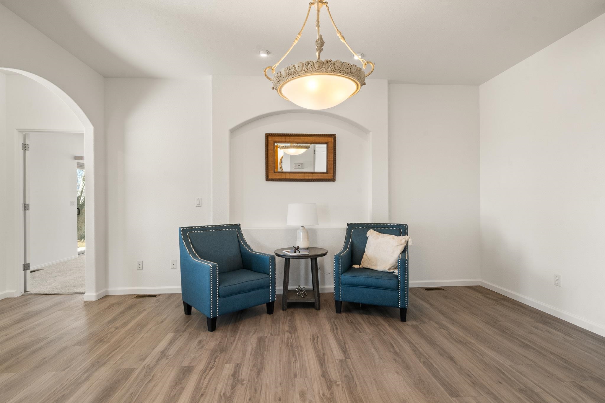 2107 I I- 1/2 Road Grand Junction, CO 81505 - Photo 20 of 42 a living room with couches and a table with wooden floor