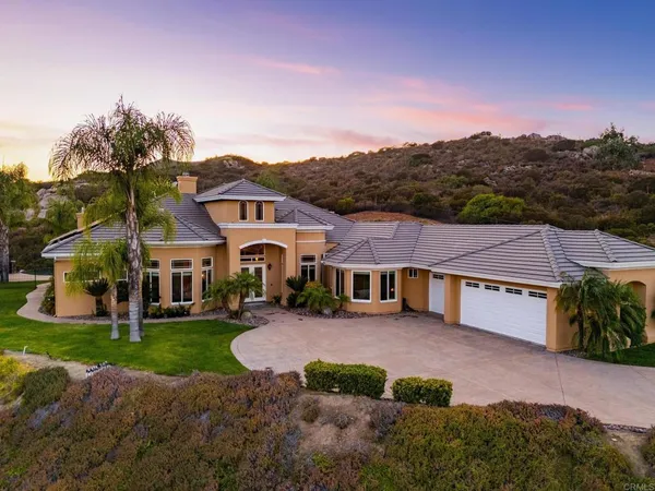 a view of a house with a big yard