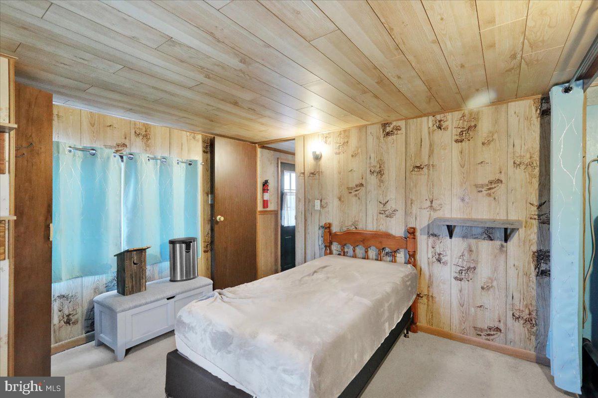 307 Donat Road Lenhartsville, PA 19534 - Photo 17 of 28 a bedroom with a bed and a mirror