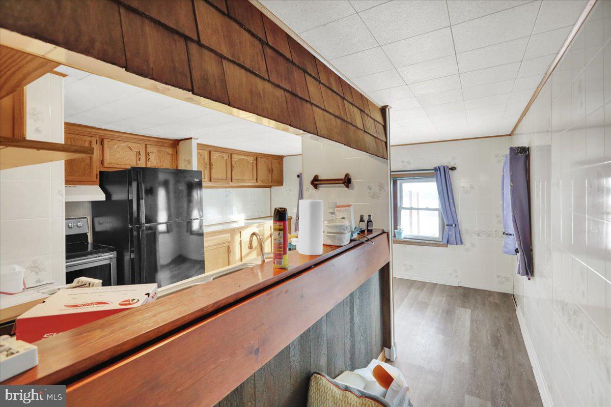 307 Donat Road Lenhartsville, PA 19534 - Photo 8 of 28 a kitchen with stainless steel appliances kitchen island granite countertop a refrigerator and a stove