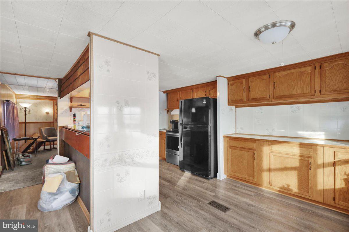 307 Donat Road Lenhartsville, PA 19534 - Photo 9 of 28 a hallway with wooden floor fireplace and living room