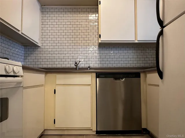 a view of granite top wall cabinets