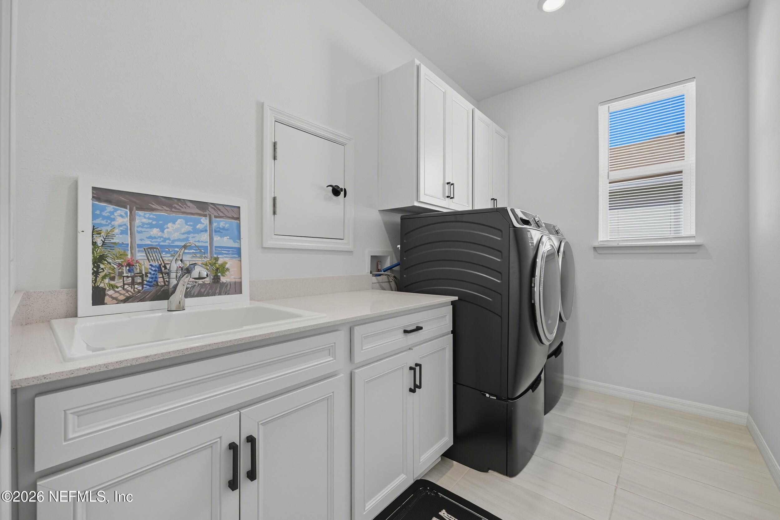 145 Lone Cypress Way St. Augustine, FL 32092 - Photo 28 of 56 a bathroom with a sink and a mirror