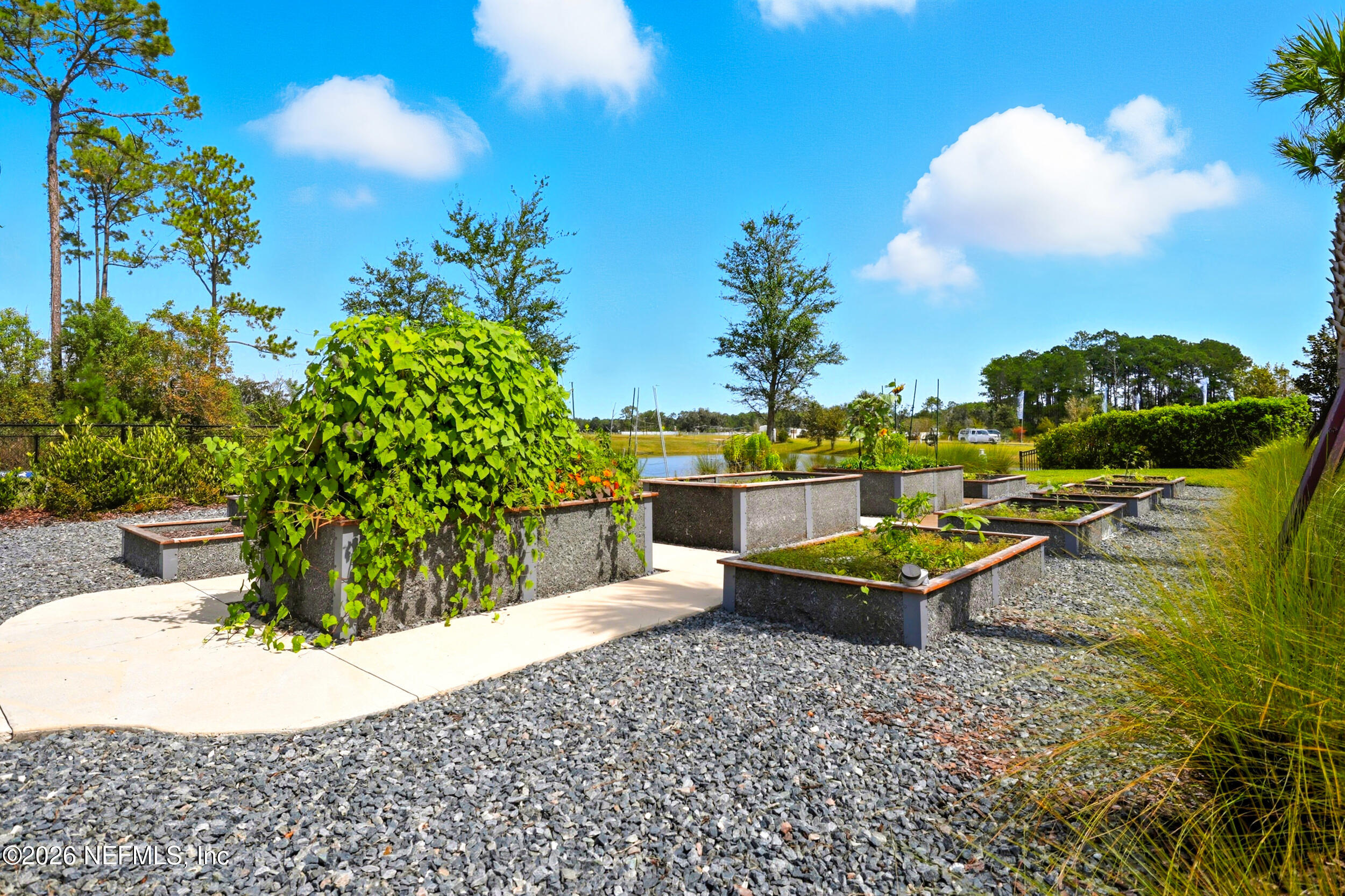 145 Lone Cypress Way St. Augustine, FL 32092 - Photo 53 of 56 a view of a chairs and table in the patio