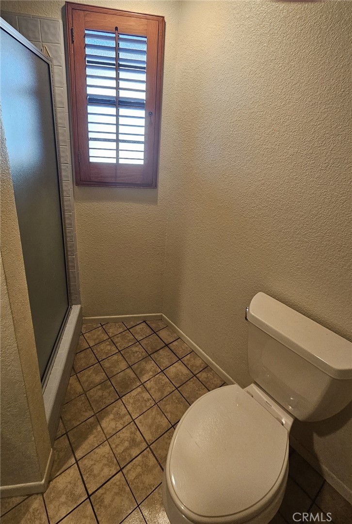 4011 Alta Vista Drive Fallbrook, CA 92028 - Photo 17 of 27 a white toilet sitting next to a window