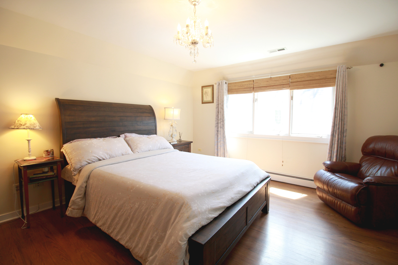 200 Ravine Road Hinsdale, IL 60521 - Photo 16 of 29 a bedroom with a bed and wooden floor