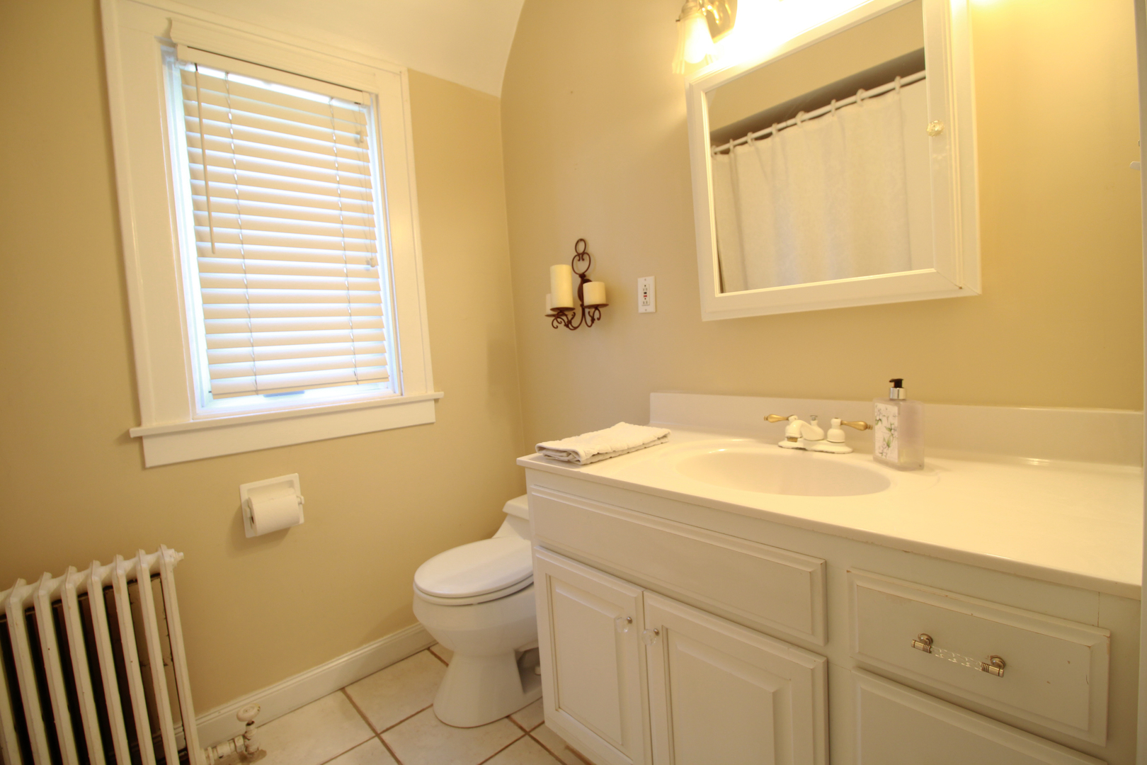 200 Ravine Road Hinsdale, IL 60521 - Photo 21 of 29 a bathroom with a granite countertop sink toilet and a mirror