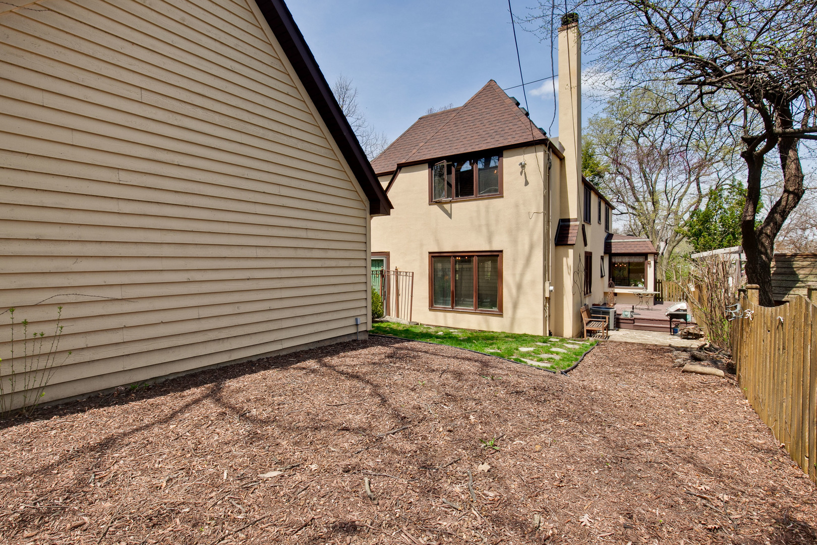 200 Ravine Road Hinsdale, IL 60521 - Photo 27 of 29 a view of a white house with a small yard and a large tree