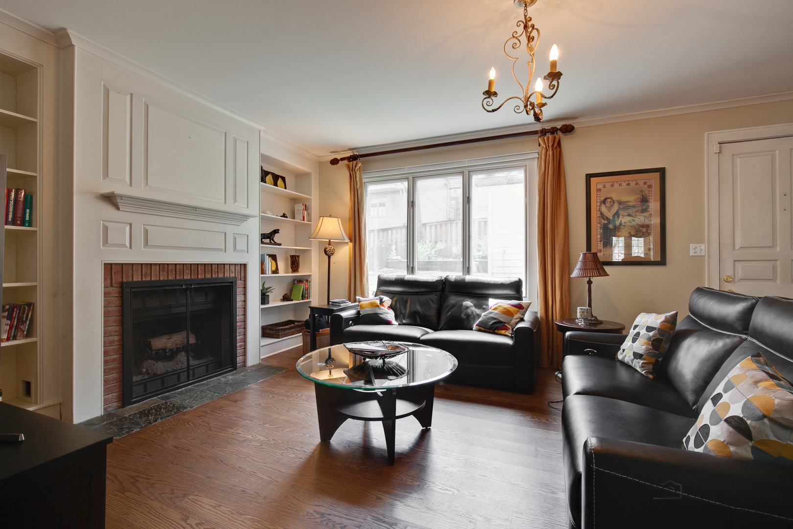 200 Ravine Road Hinsdale, IL 60521 - Photo 7 of 29 a living room with furniture a fireplace and a large window