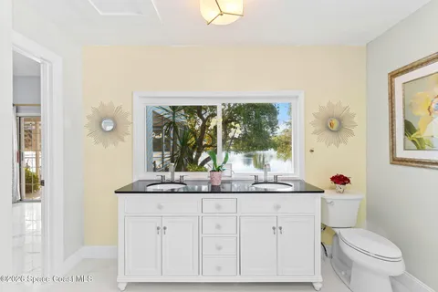 an aerial view of a house with a swimming pool yard and outdoor seating