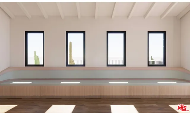 a view of an empty room with windows
