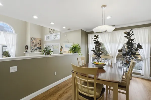 a view of a dining room with furniture and window