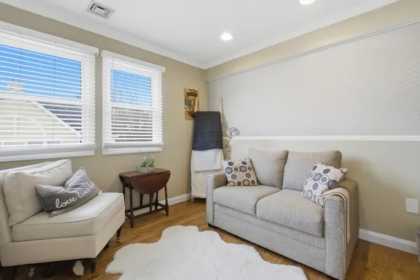 a living room with furniture and windows