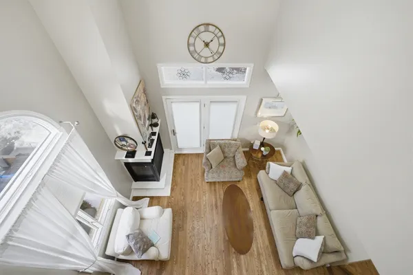 a view of living room with furniture and a clock