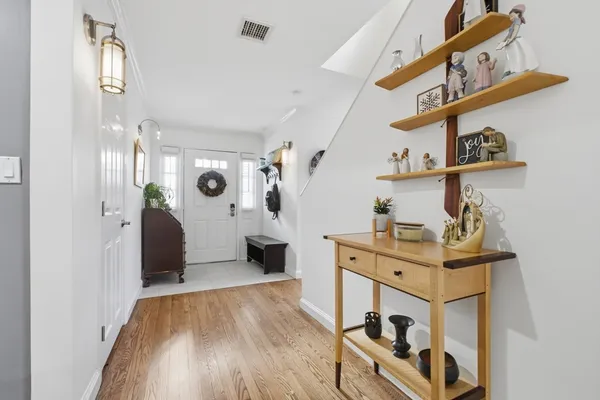 a view of a room that has a table and a chair in it