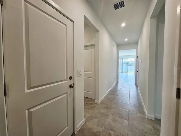 a kitchen with a stove a sink and a refrigerator