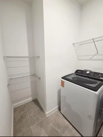 a kitchen with stainless steel appliances granite countertop a stove top oven a refrigerator a sink and a granite counter tops