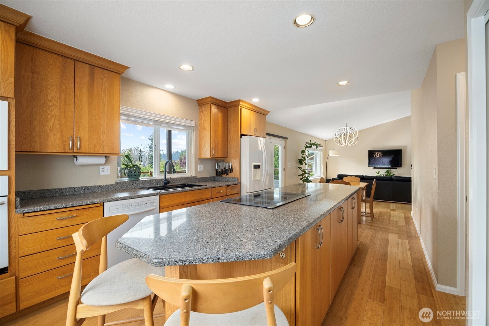 1000 Samish Way Bellingham, WA 98229 - Photo 11 of 40 a kitchen with stainless steel appliances granite countertop sink stove refrigerator and cabinets