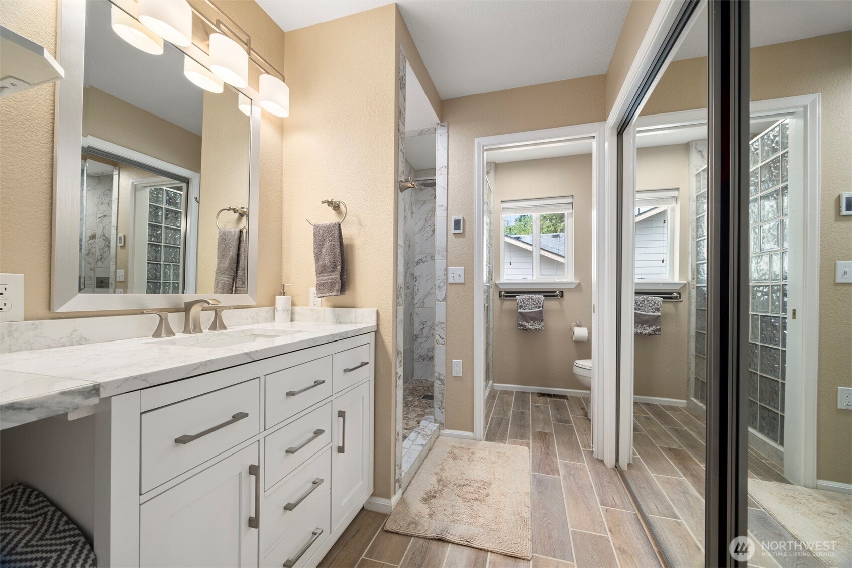 1000 Samish Way Bellingham, WA 98229 - Photo 15 of 40 a bathroom with a granite countertop sink mirror and a shower