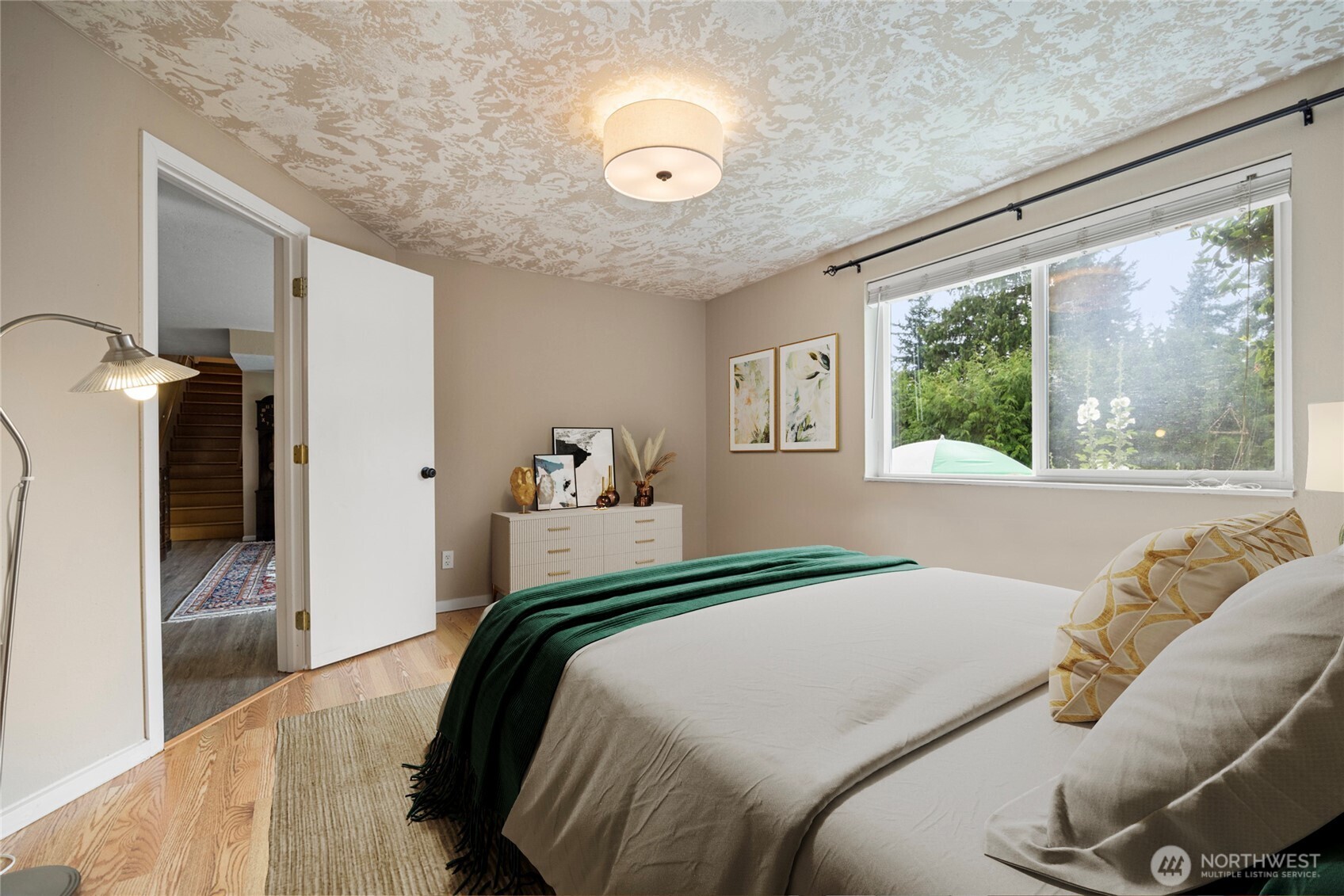 1000 Samish Way Bellingham, WA 98229 - Photo 23 of 40 a bedroom with a large bed and a large window