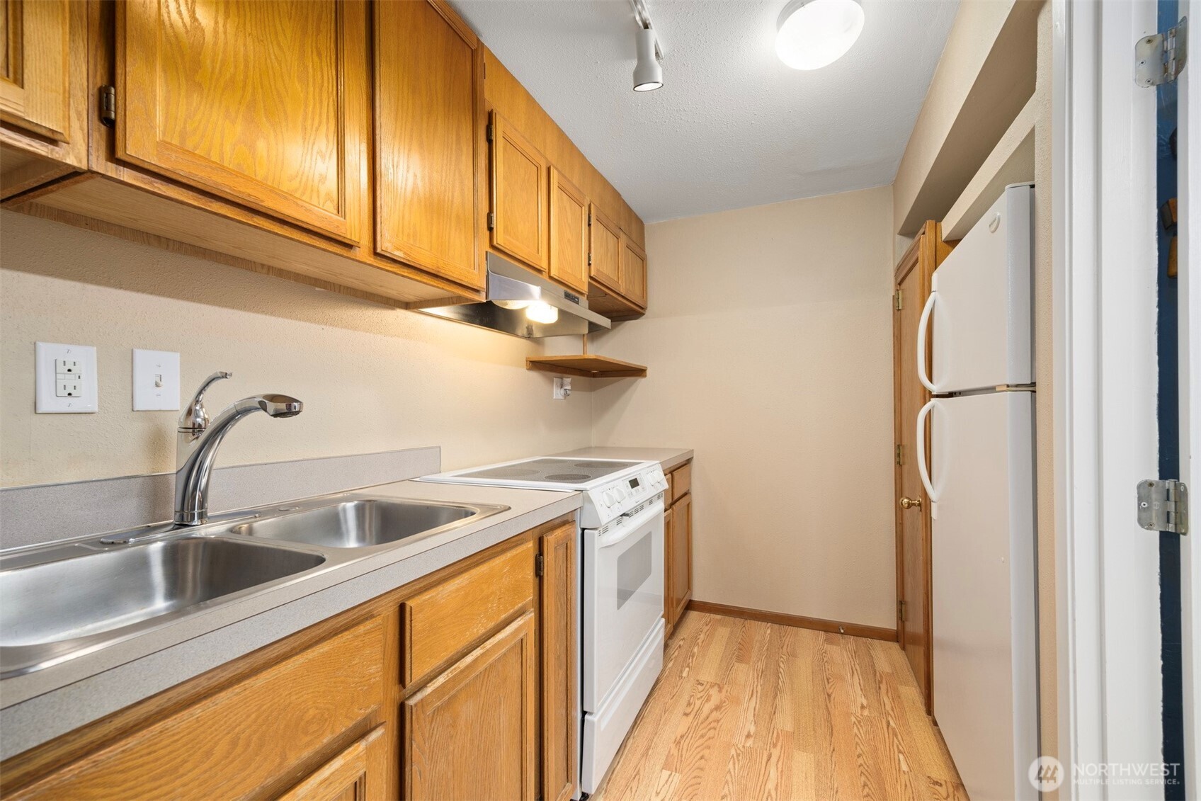 1000 Samish Way Bellingham, WA 98229 - Photo 28 of 40 a kitchen with a sink and cabinets