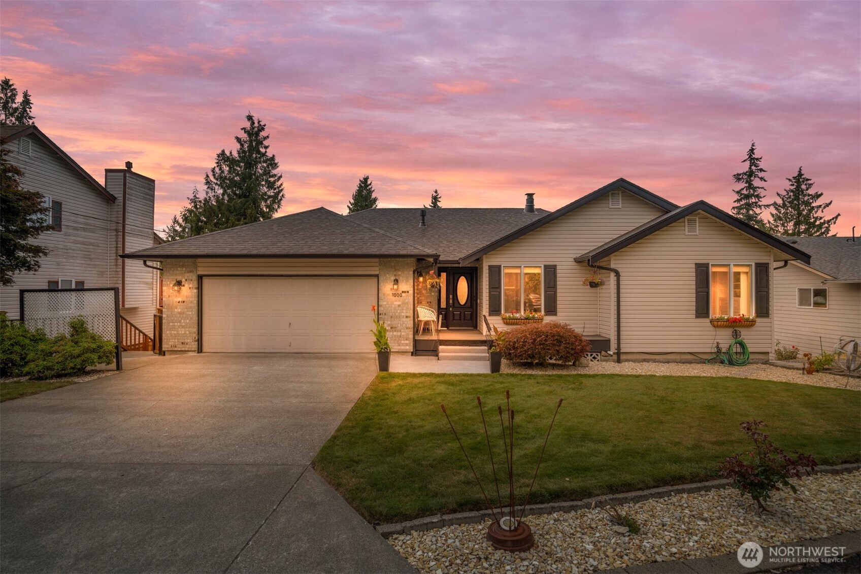 1000 Samish Way Bellingham, WA 98229 - Photo 3 of 40 a front view of a house with a garden and yard