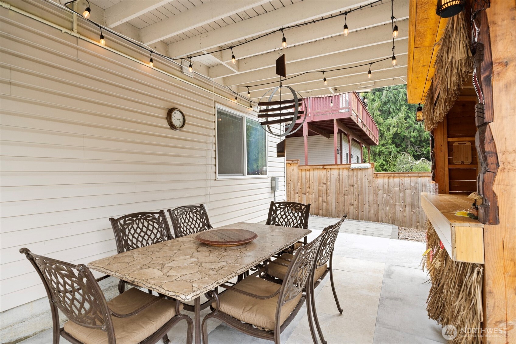 1000 Samish Way Bellingham, WA 98229 - Photo 32 of 40 a view of a patio with table and chairs with wooden floor and fence